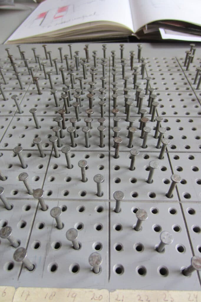 pins in a certain pattern for weaving