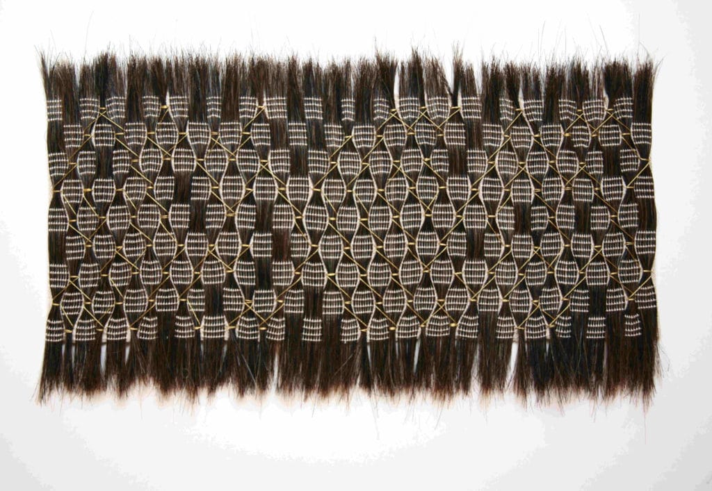 black horsehair smocked textiles