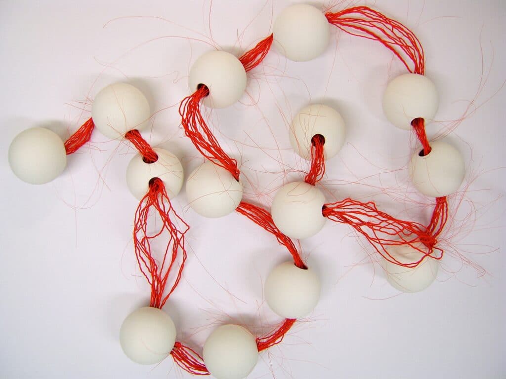 ceramics balls with red horsehair