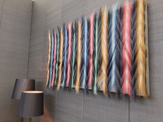 pink yellow artpiece on wall