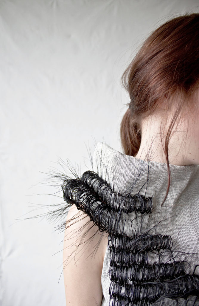 dress with horsehair woven curls on shoulder