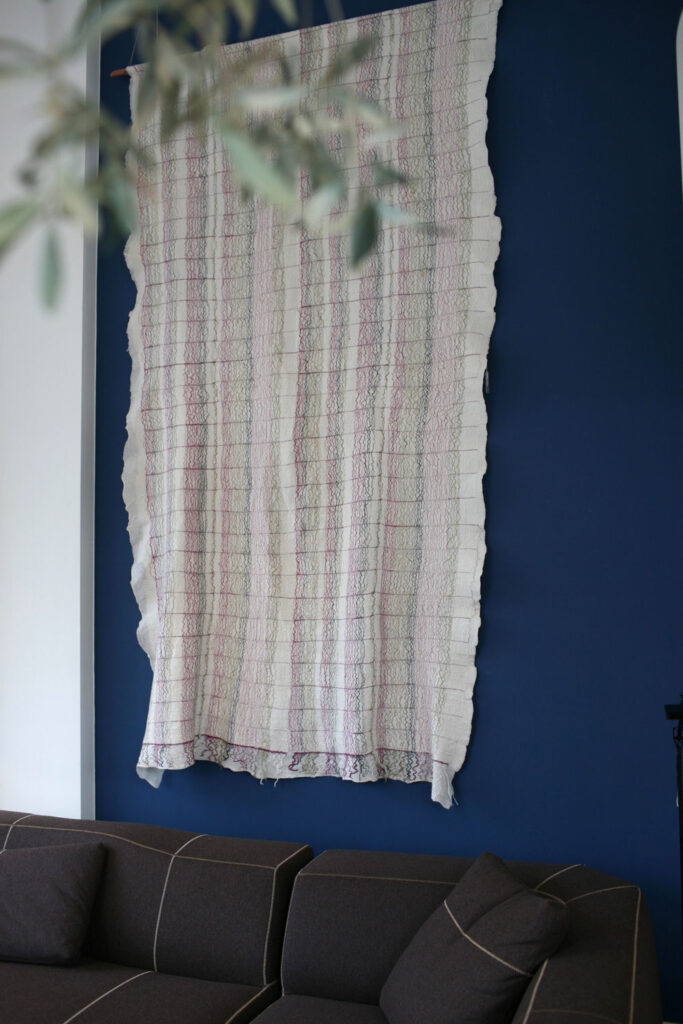 tapestry on blue wall