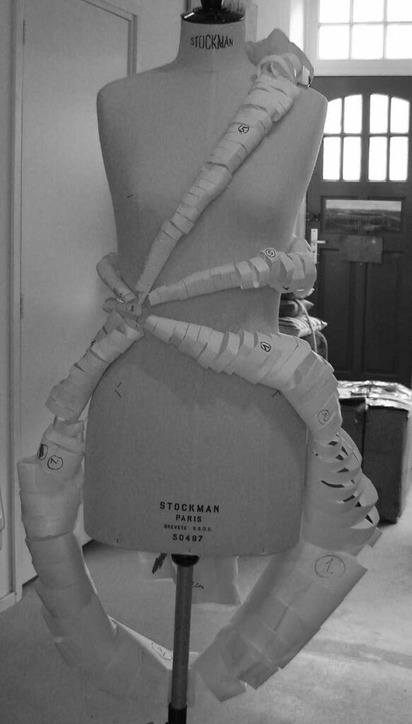 paper curls on mannequin sketch